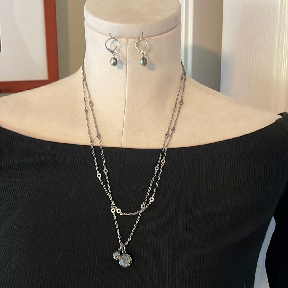 Silver necklace and earrings with faceted crystal accents